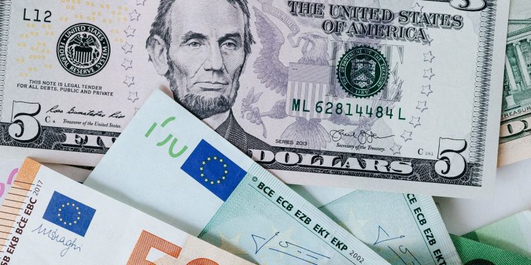 Different Currencies Placed on a Table