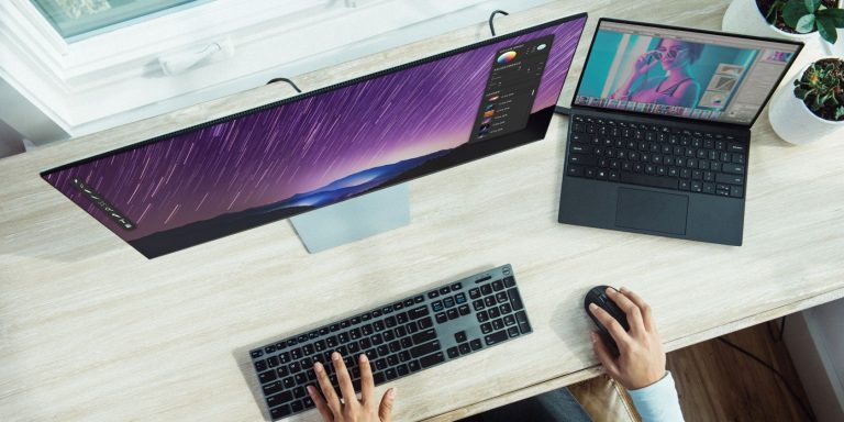 Person using a dual monitor setup