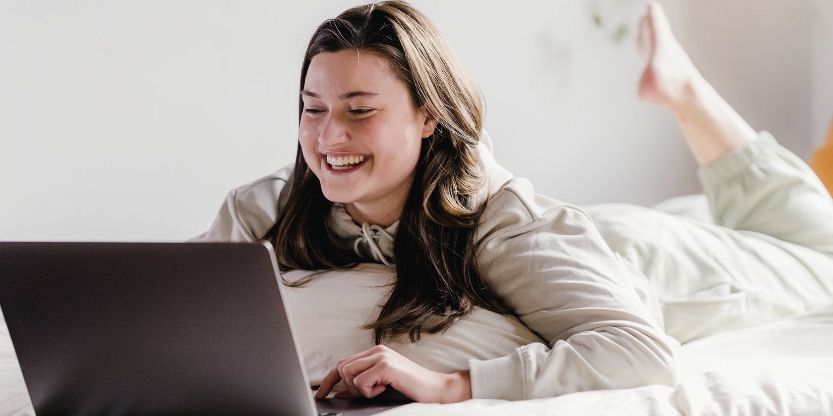 lady happily staring at pc