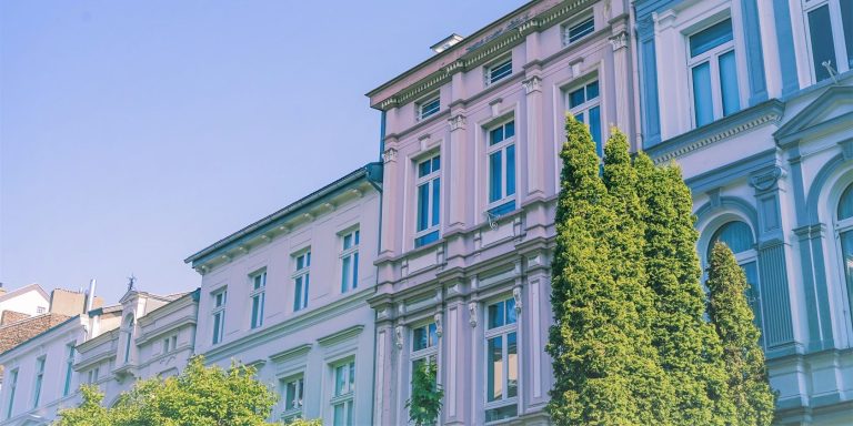 overexposed photo of white concrete buildings