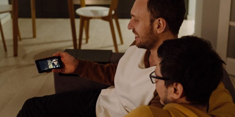 men watching tv on phone