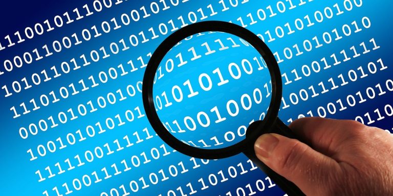magnifying glass and binary