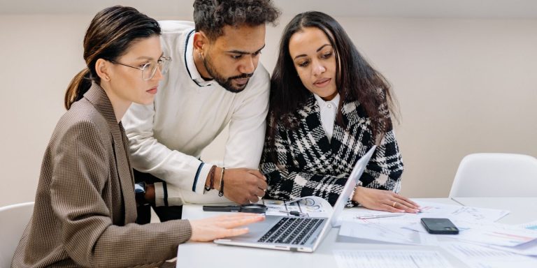 man and women looking at a laptop