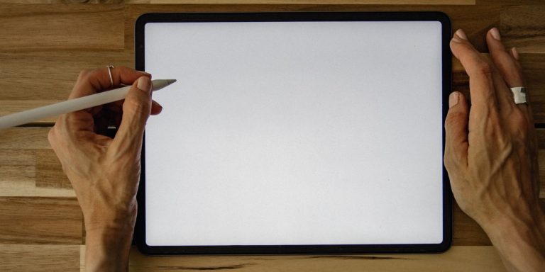 person using apple pencil with an ipad