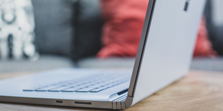 Open Windows laptop on wooden table