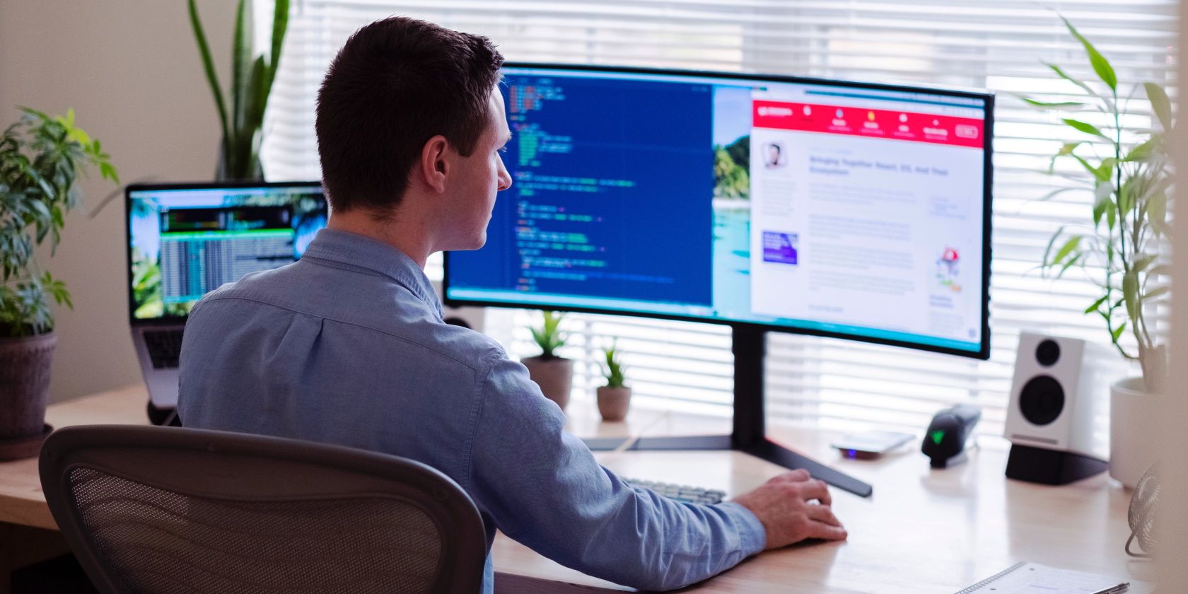 Person using a dual monitor setup in an office