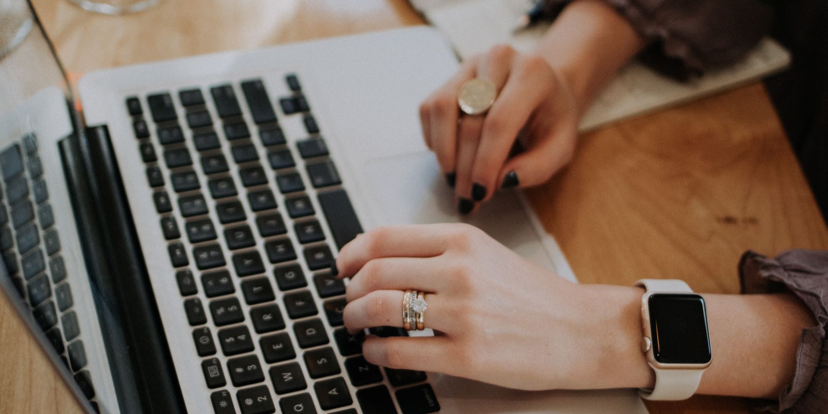 The woman is working on her laptop