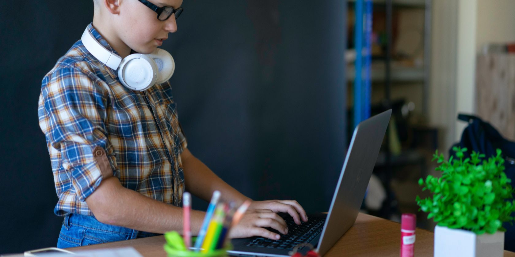 a boy using a laptop