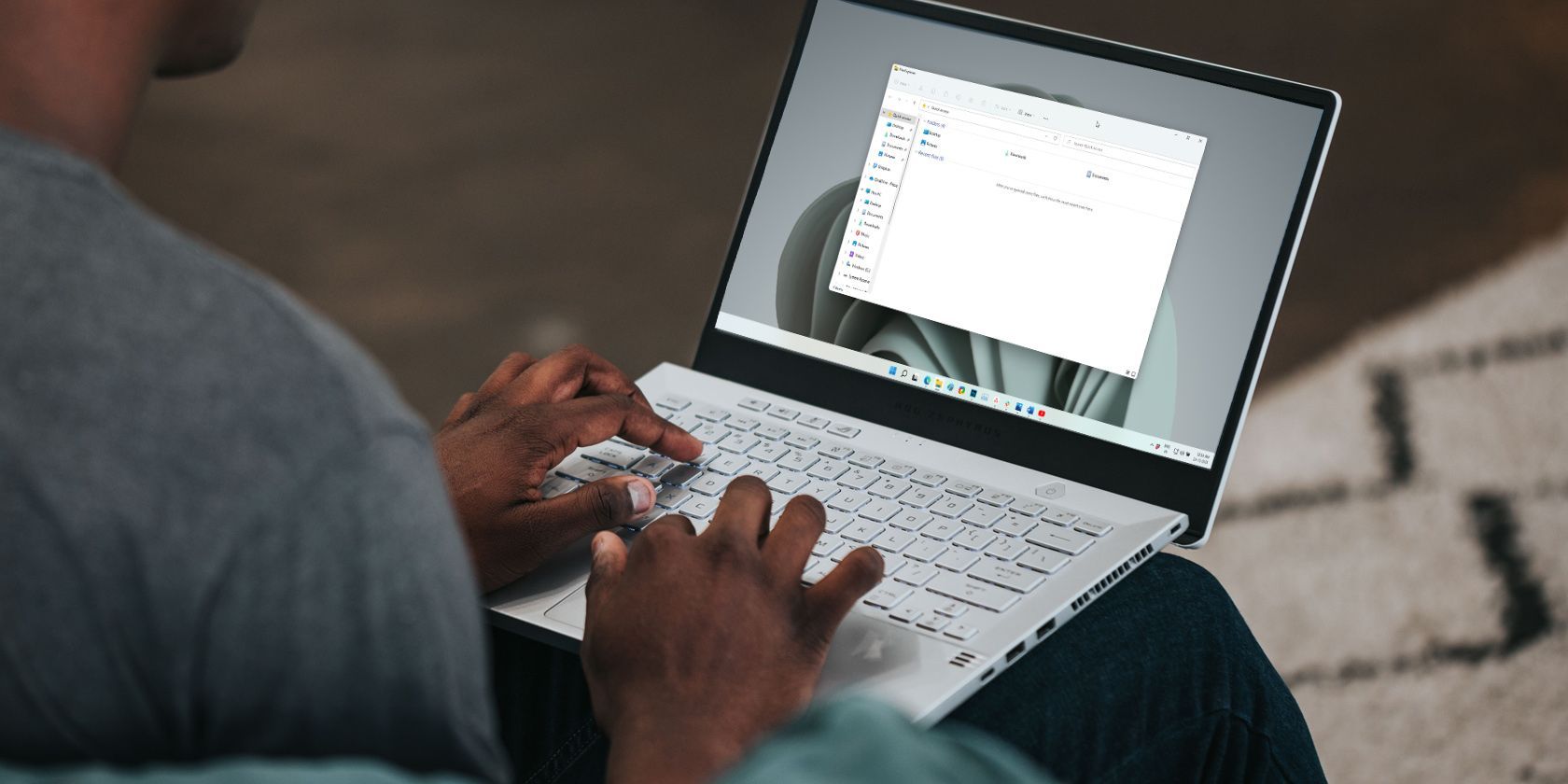 a man working on a windows laptop