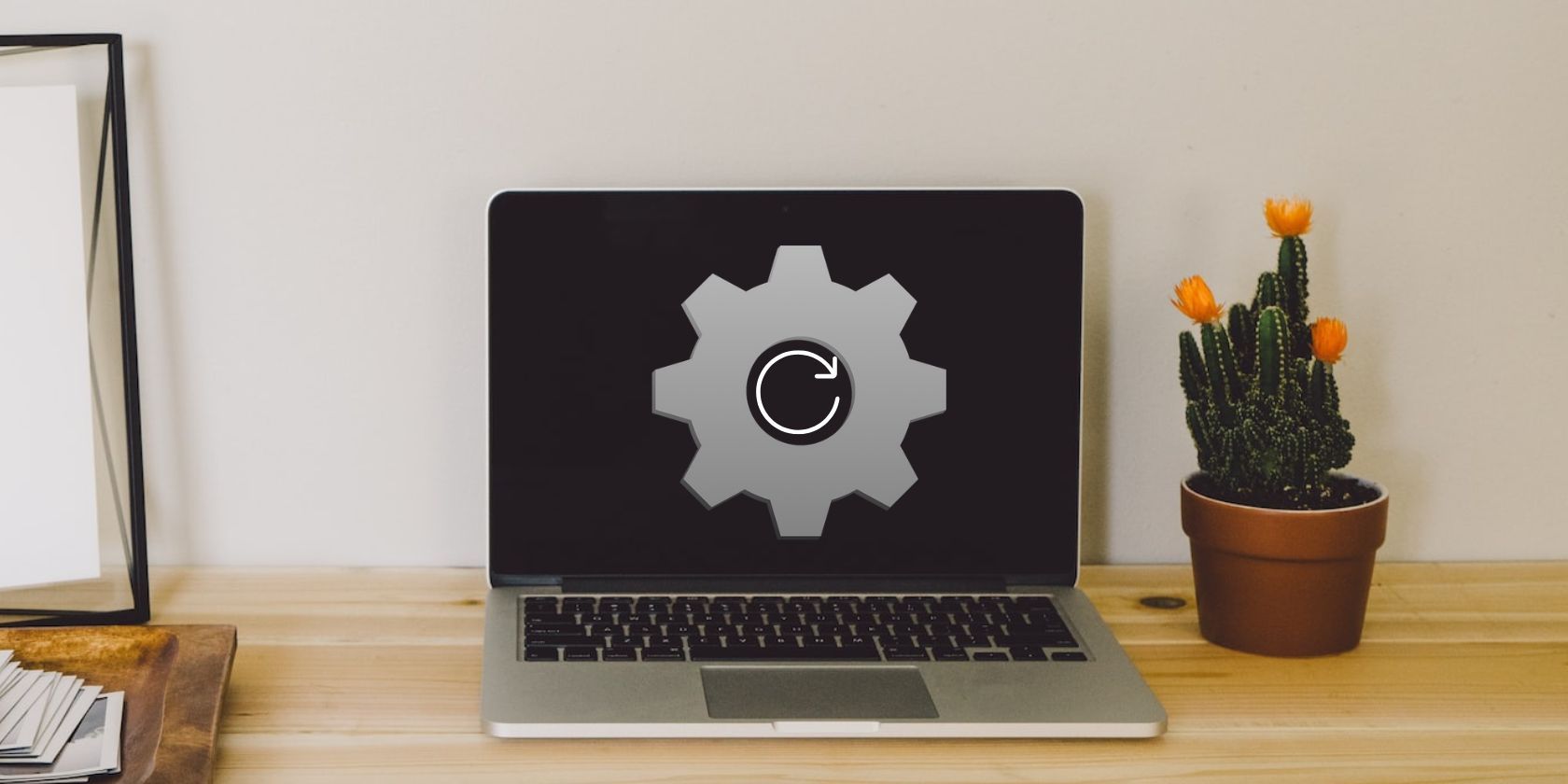 gray laptop on a wooden table