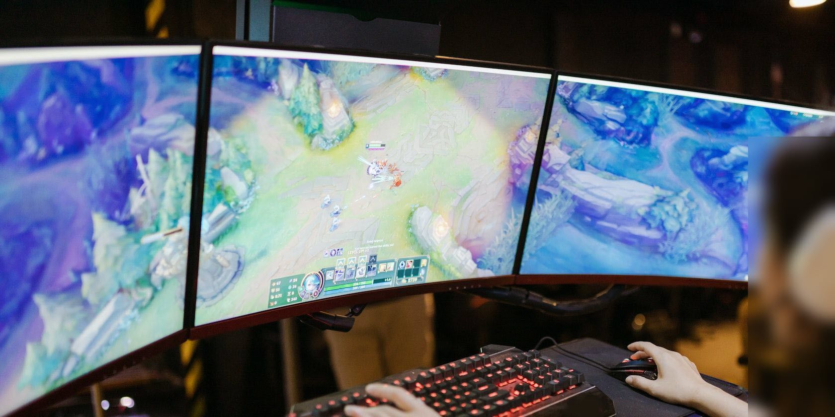 woman playing league of legends on a pc