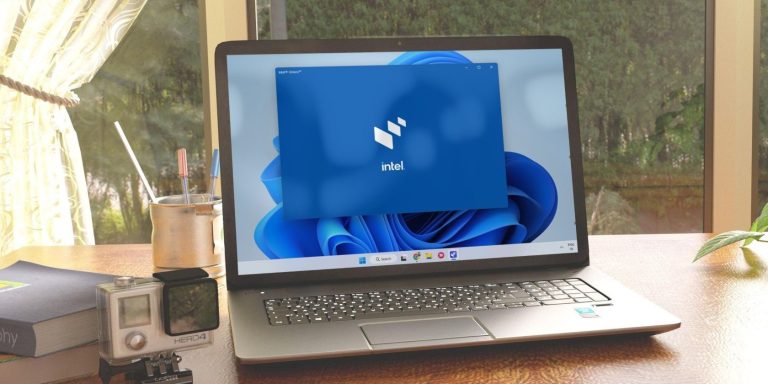 a silver laptop on a wooden table