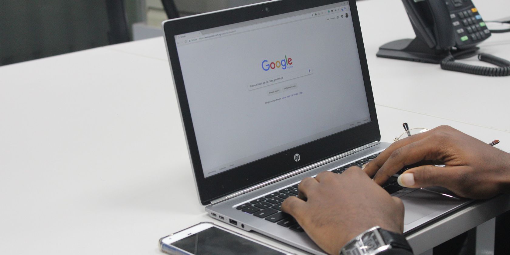 man working on his hp laptop