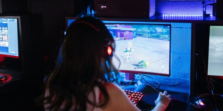 person playing game on pc