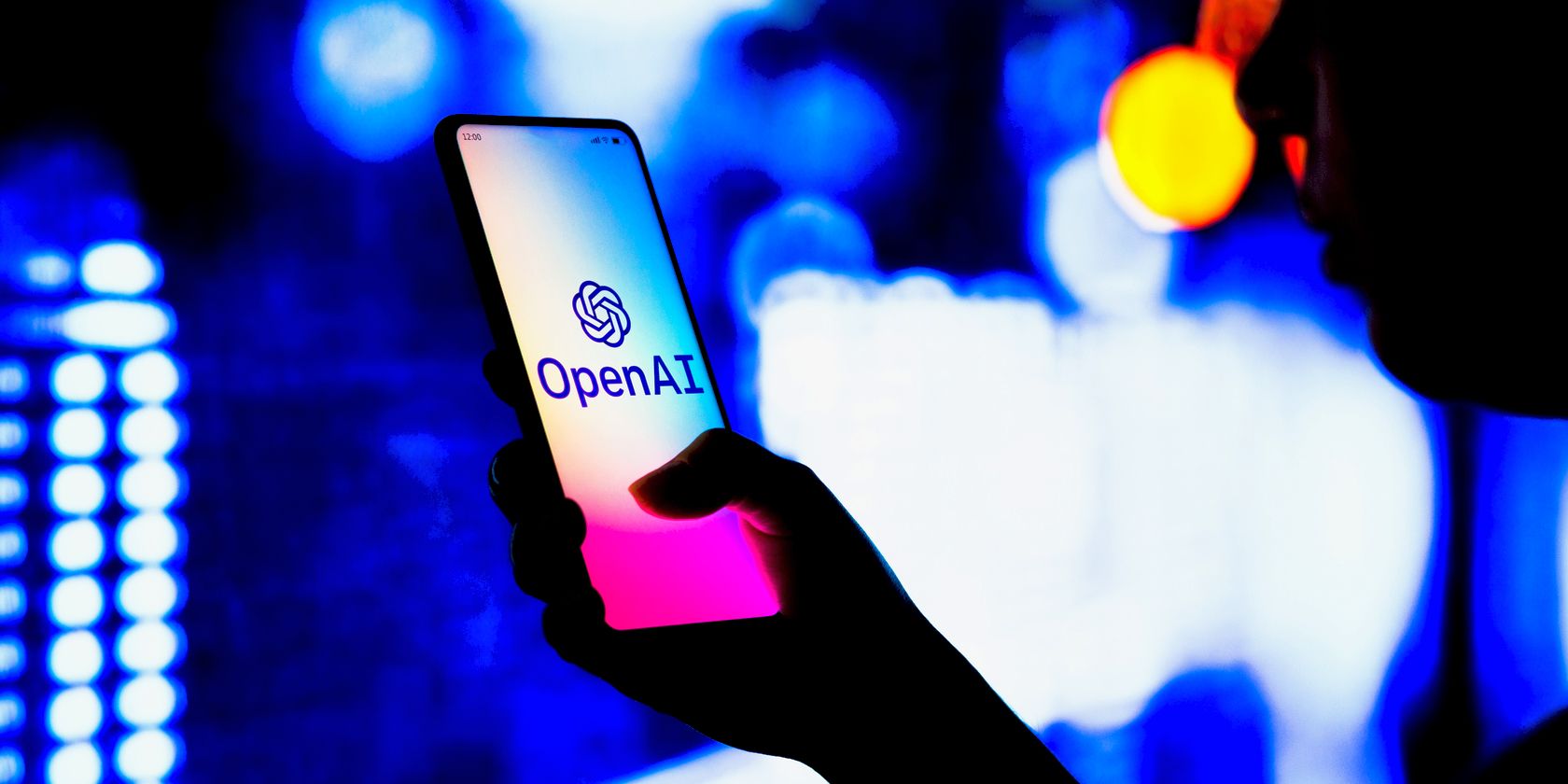 openai logo on smartphone being held feature