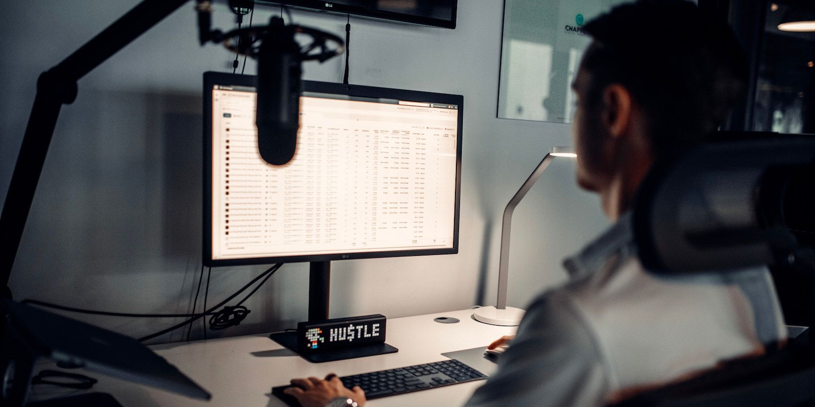 man with microphone on computer