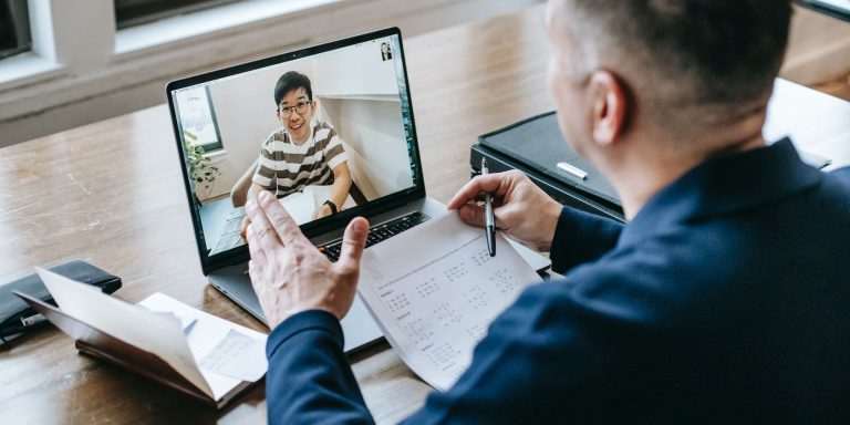 a professor teaching a student over the internet