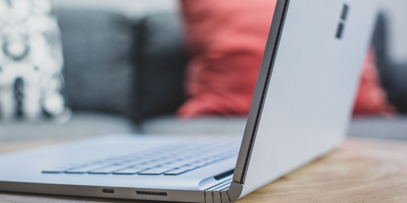 a windows laptop is placed on a wooden table