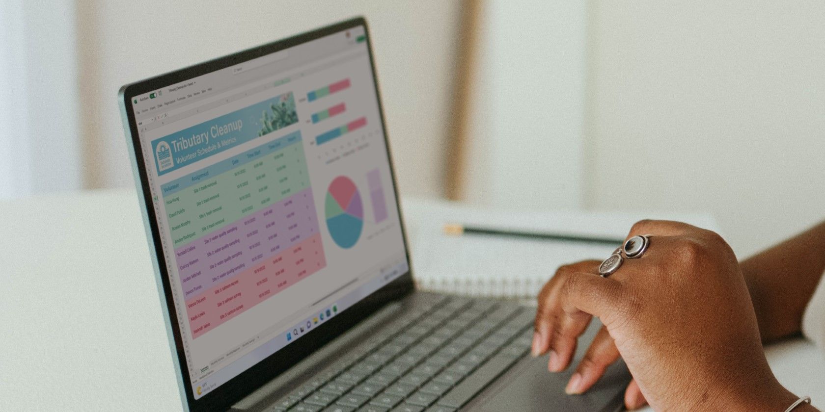 a woman using excel on a windows laptop 1