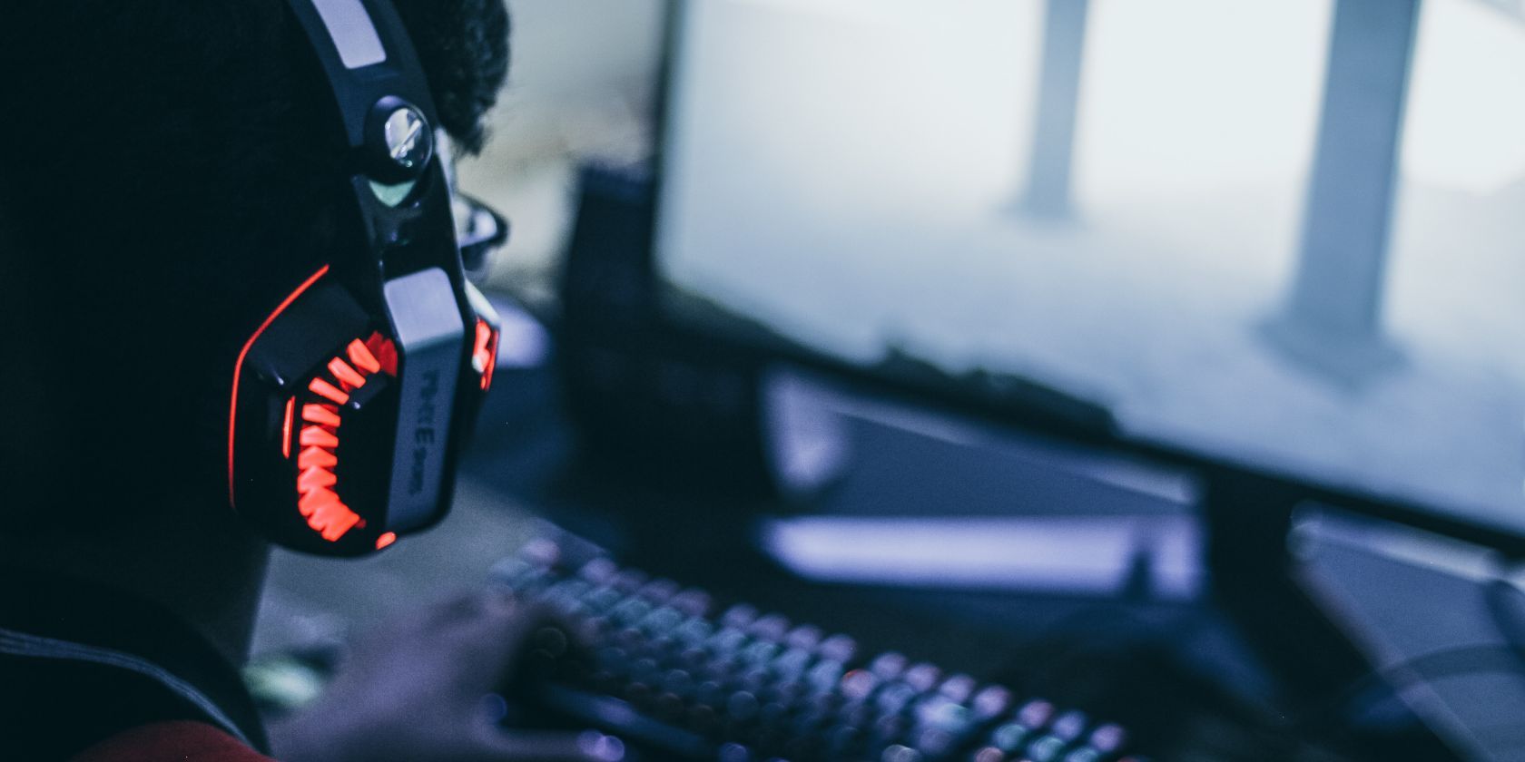 gamer using red and black headset for voice chat