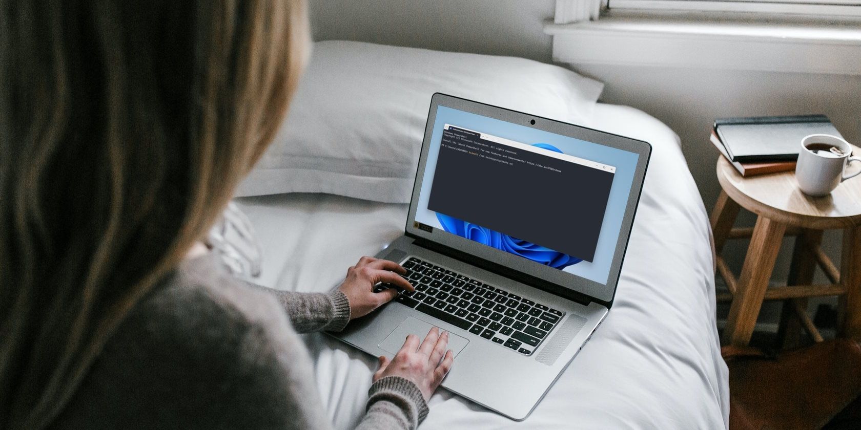woman using windows computer on bed 1