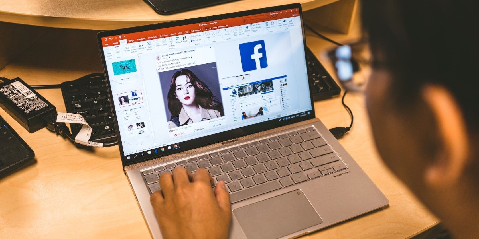 A person using powerpoint on a laptop.jpg