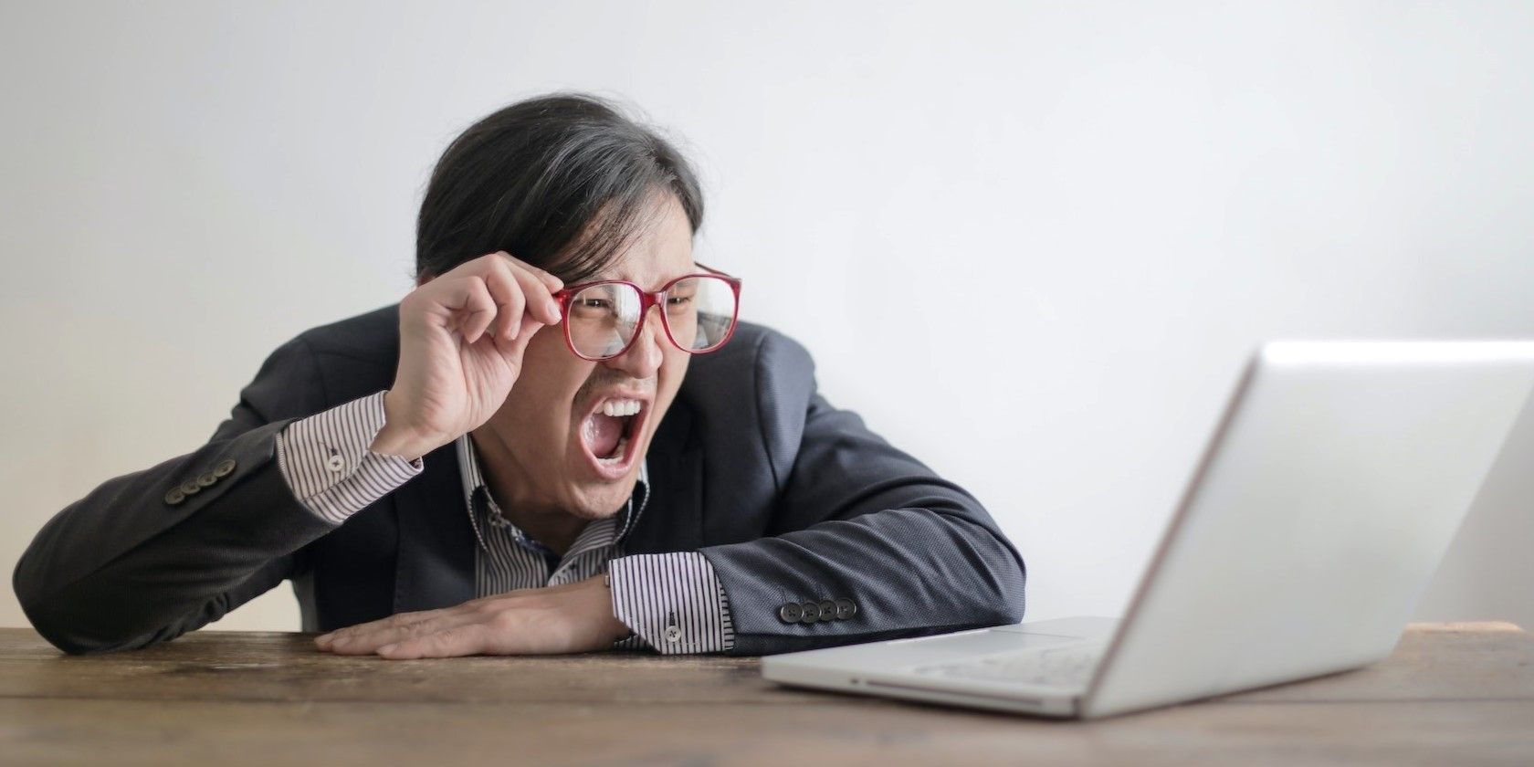 a woman yelling at her laptop