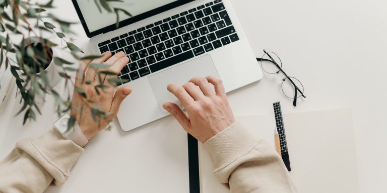 image showing a pair of hands working on a computer 1