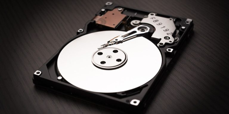 a computer hard disk on a black surface