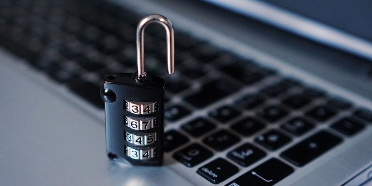 a padlock and laptop