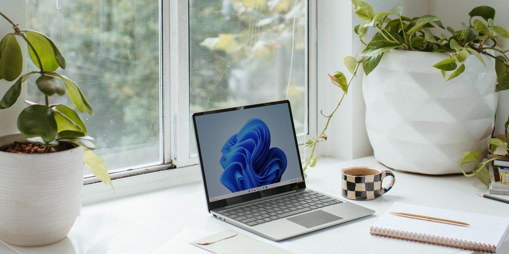 windows 11 laptop on white desk